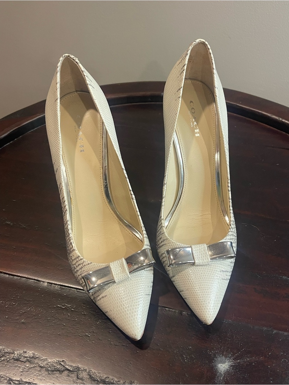 Coach Ivory Pointed Toe Bow Pumps with Silver Accent